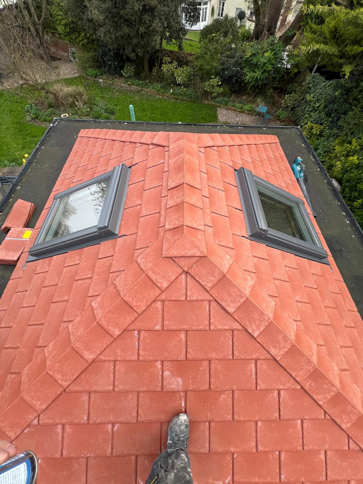 Two rooflights set into a tiled roof